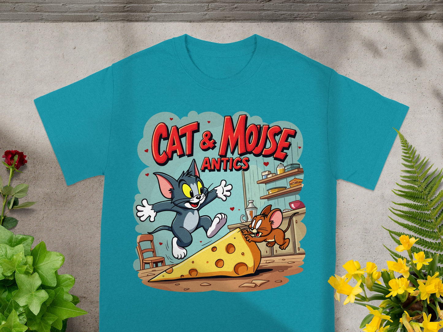 Tom and Jerry chasing cheese on a teal t-shirt.