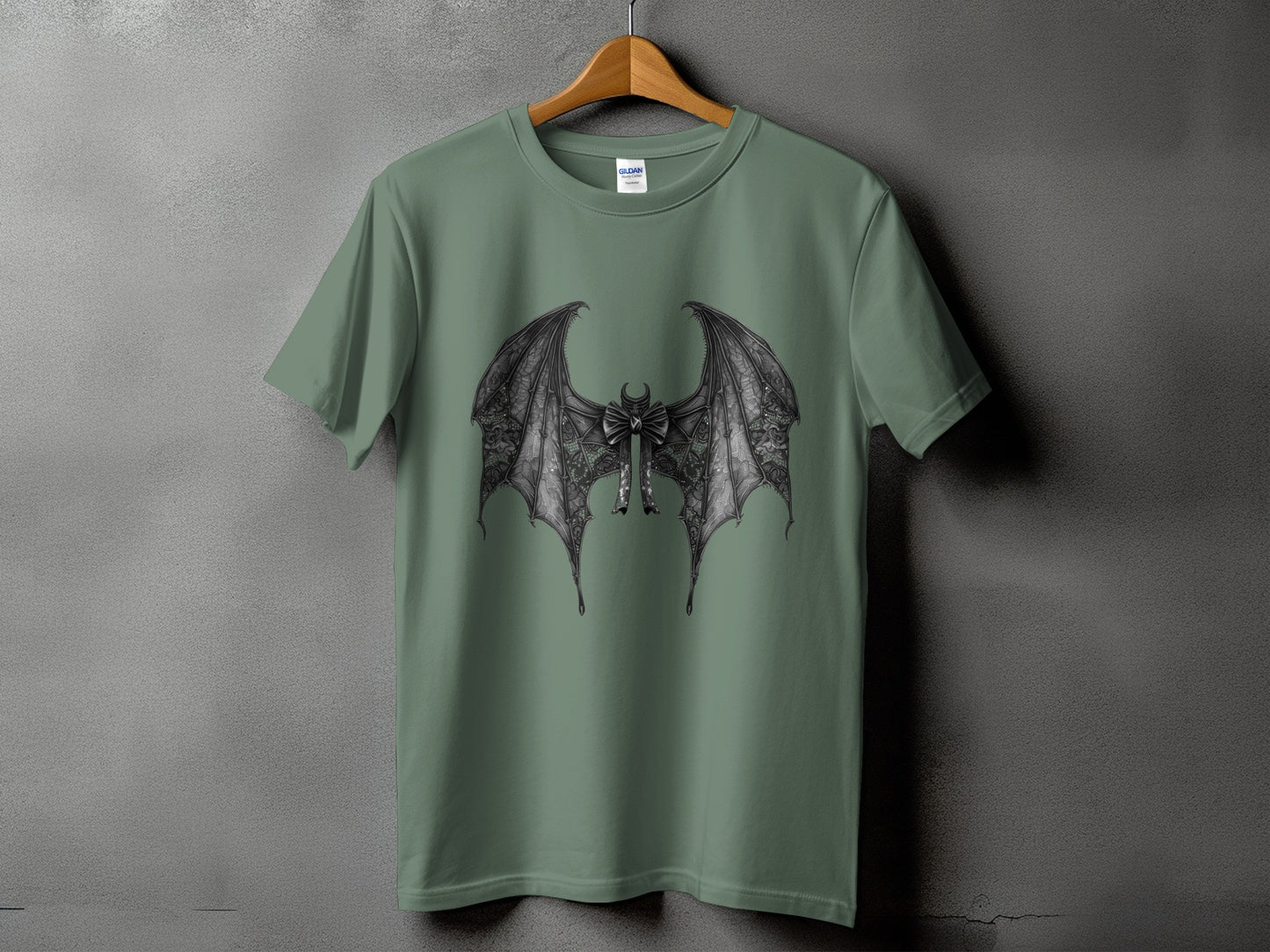 Green t-shirt with detailed black dragon wings and a bow graphic.