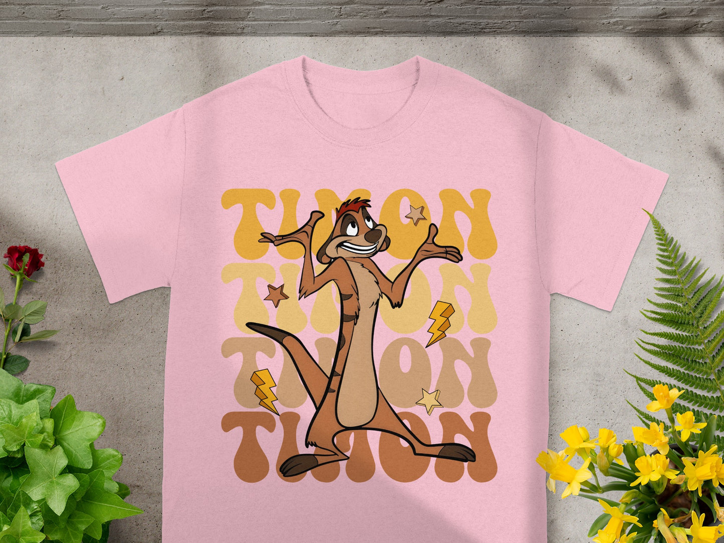 Pink t-shirt with Timon from The Lion King graphic and retro font.