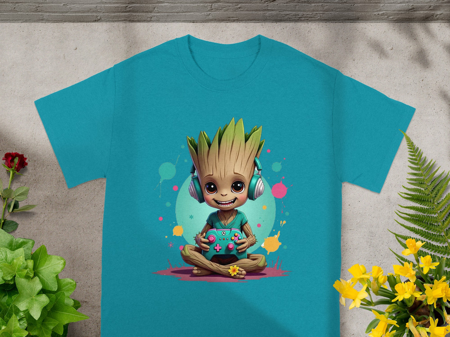 Teal t-shirt featuring Groot wearing headphones and playing a video game.