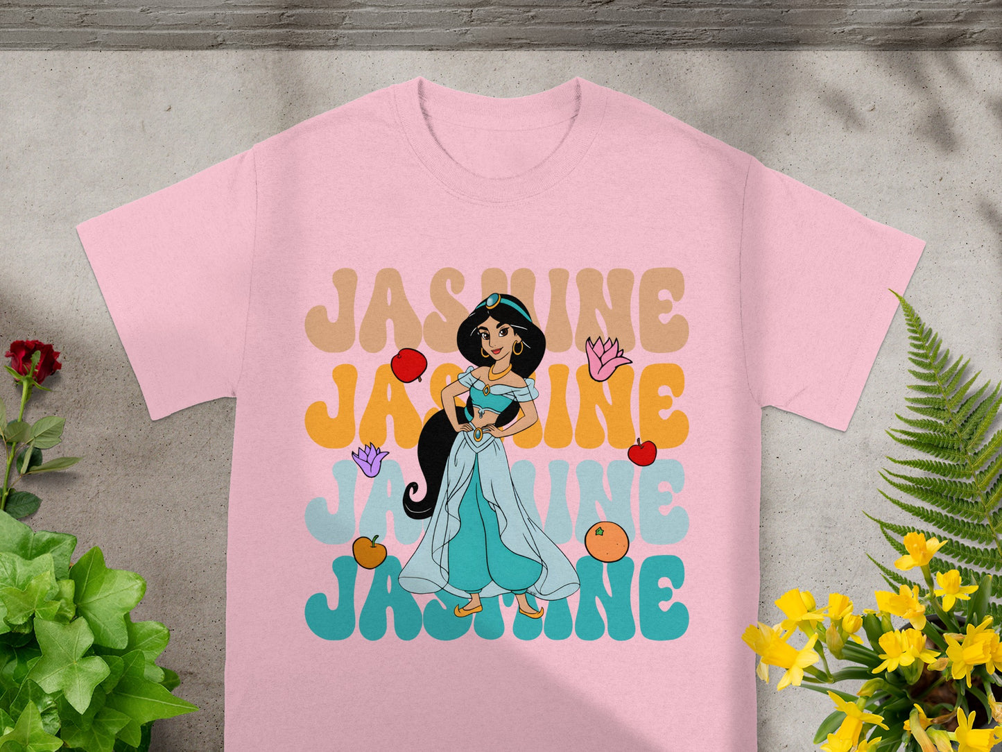Pink t-shirt with Jasmine character and colorful text "JASMINE".