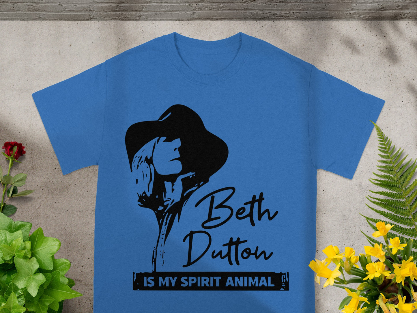 Blue t-shirt with black graphic of woman and text "Beth Dutton IS MY SPIRIT ANIMAL".