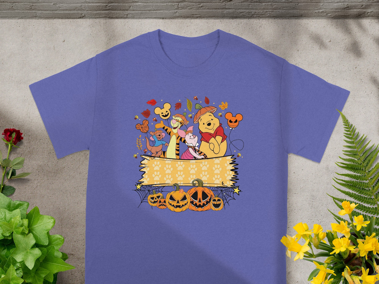 Winnie the Pooh characters with pumpkins and autumn leaves, Halloween design.