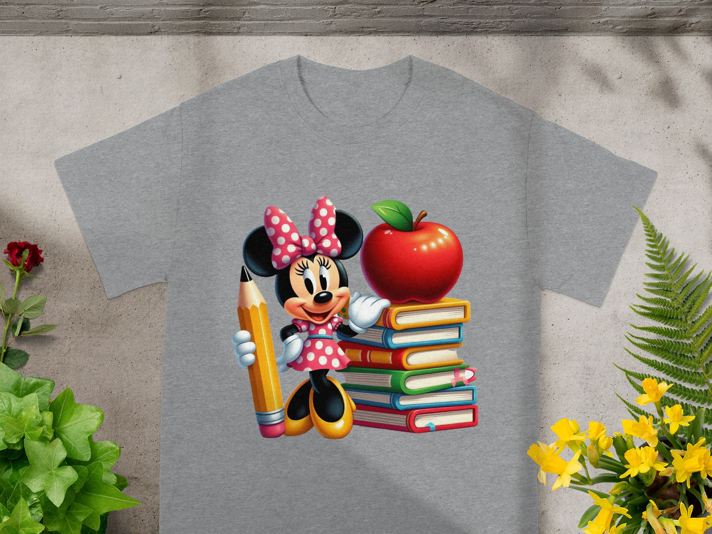 Minnie Mouse holding a pencil next to a stack of books and an apple.