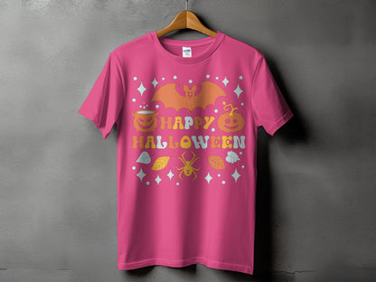 Pink t-shirt with "Happy Halloween" text and retro-style bat, pumpkin, and spider graphics.