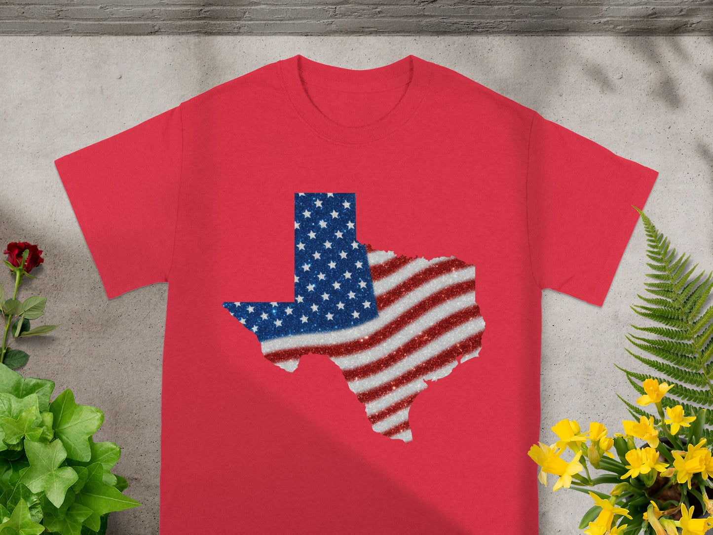Red t-shirt with glitter Texas shape filled with American flag colors.