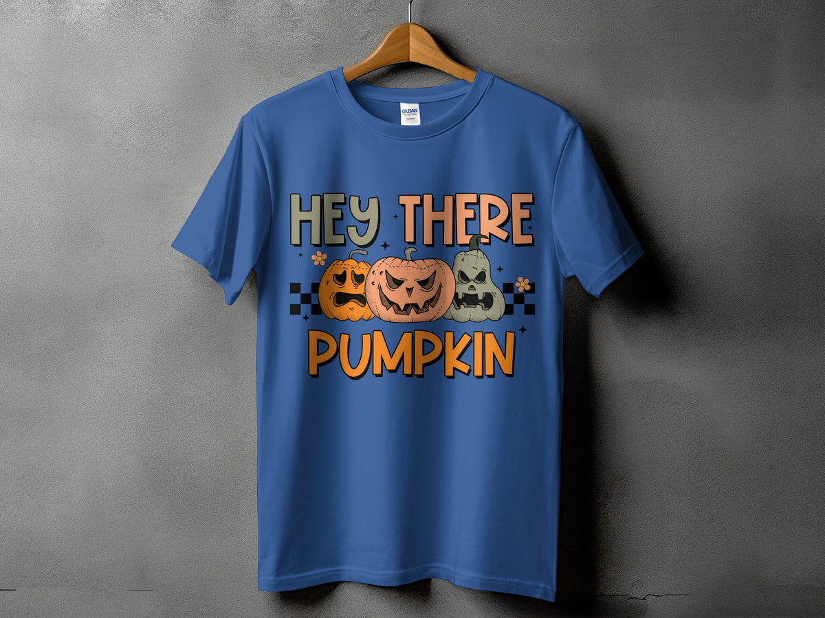 Blue t-shirt with Halloween graphic text "HEY THERE PUMPKIN" and three pumpkins.