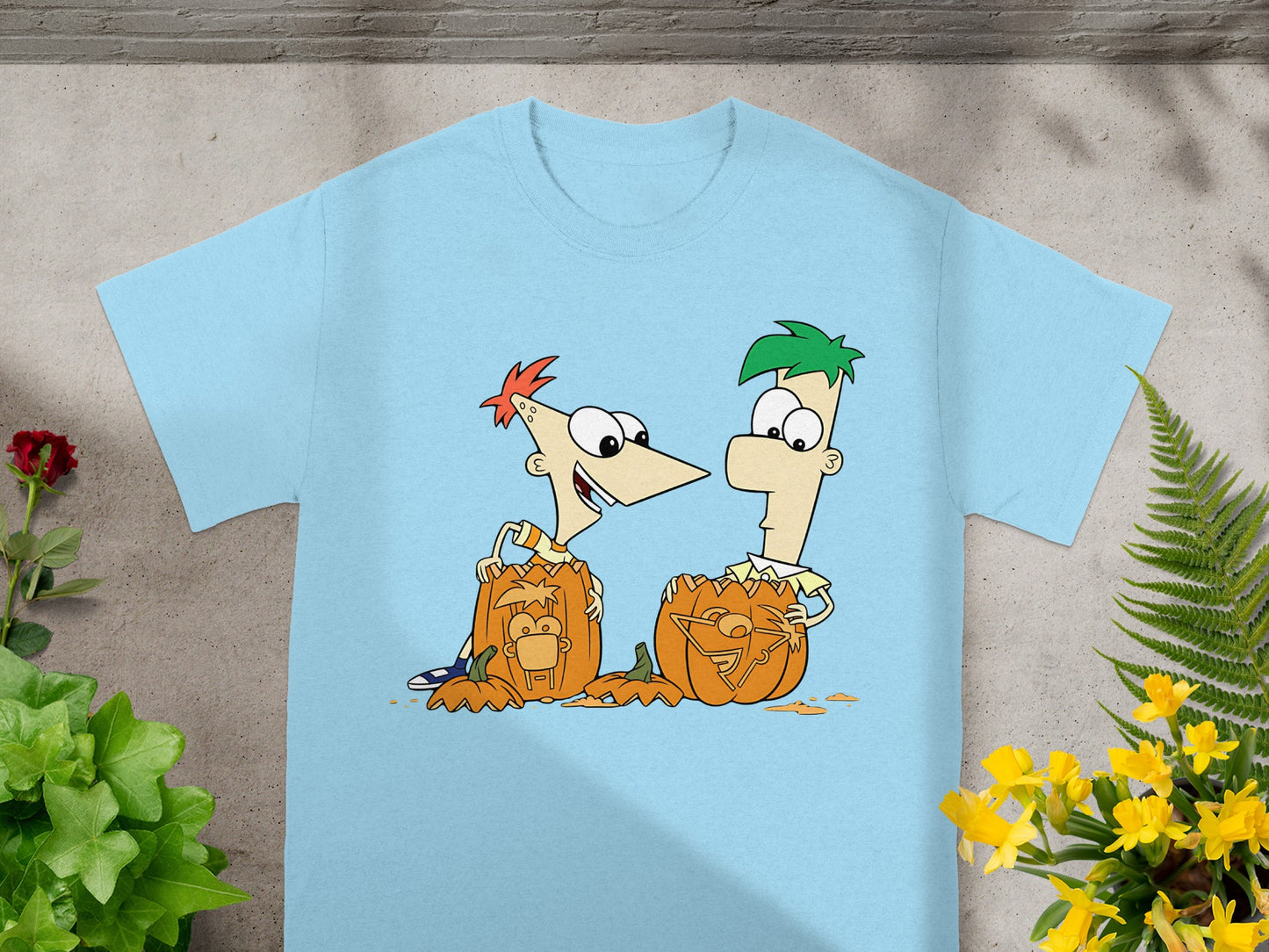 Phineas and Ferb carving Halloween pumpkins with cartoon characters on them.