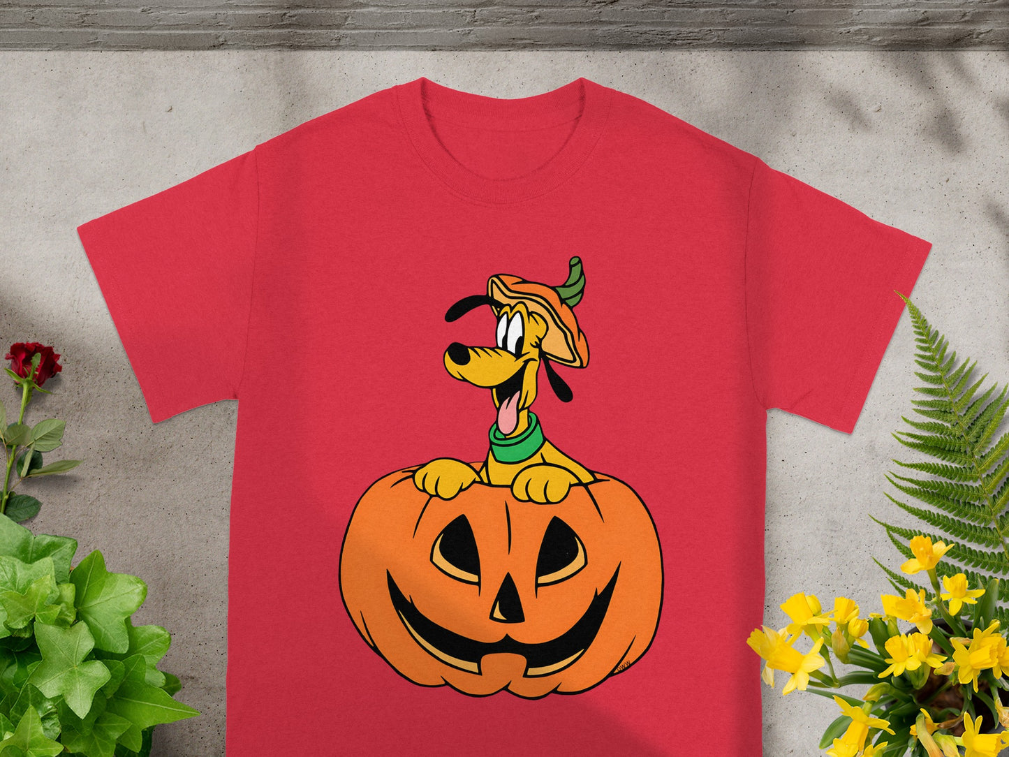 Red t-shirt with Pluto peeking out of a jack-o'-lantern.