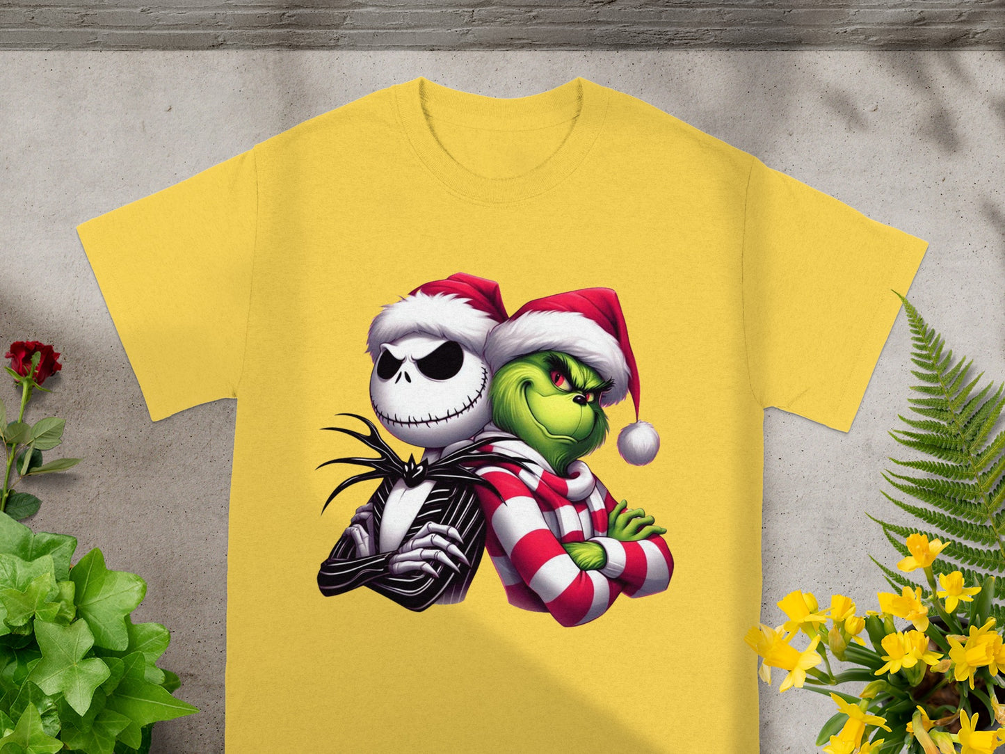 Yellow t-shirt with Jack Skellington and The Grinch in Santa hats.