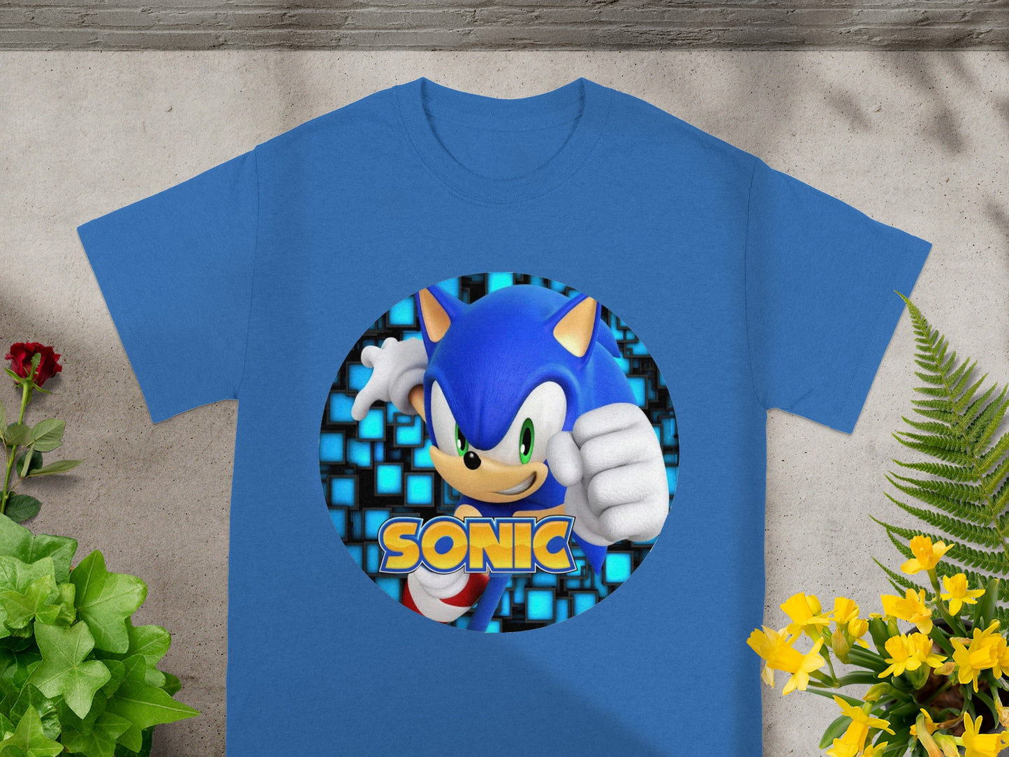 Blue t-shirt with Sonic the Hedgehog graphic and checkered background.