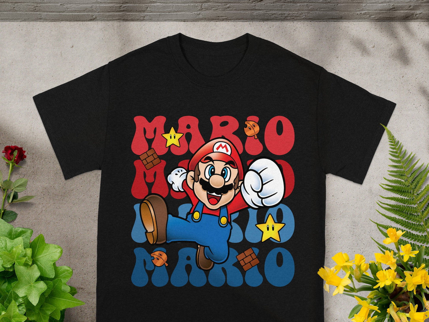 Black t-shirt with Mario character and "MARIO" text in wavy font.