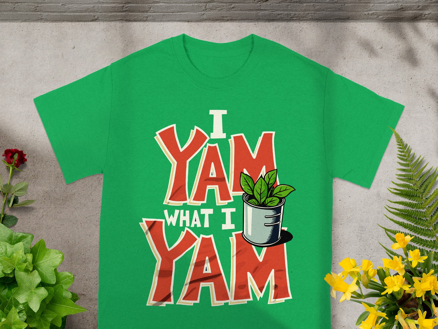 Green t-shirt with "I Yam What I Yam" text and potted plant graphic.