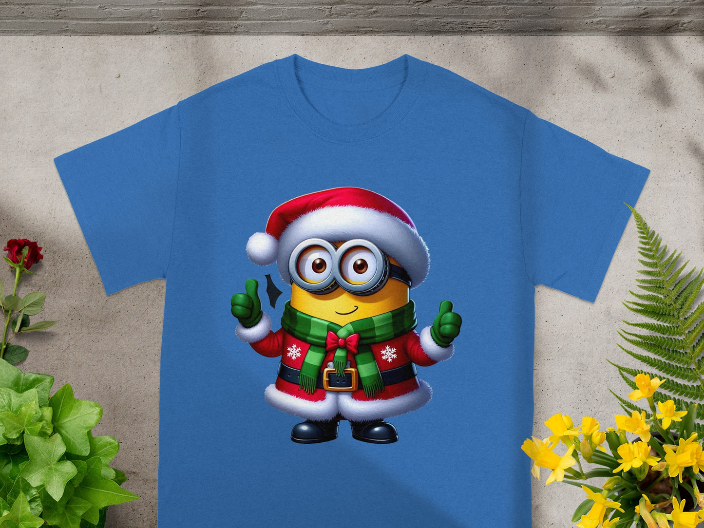 Minion wearing a Santa hat and Christmas outfit giving two thumbs up.