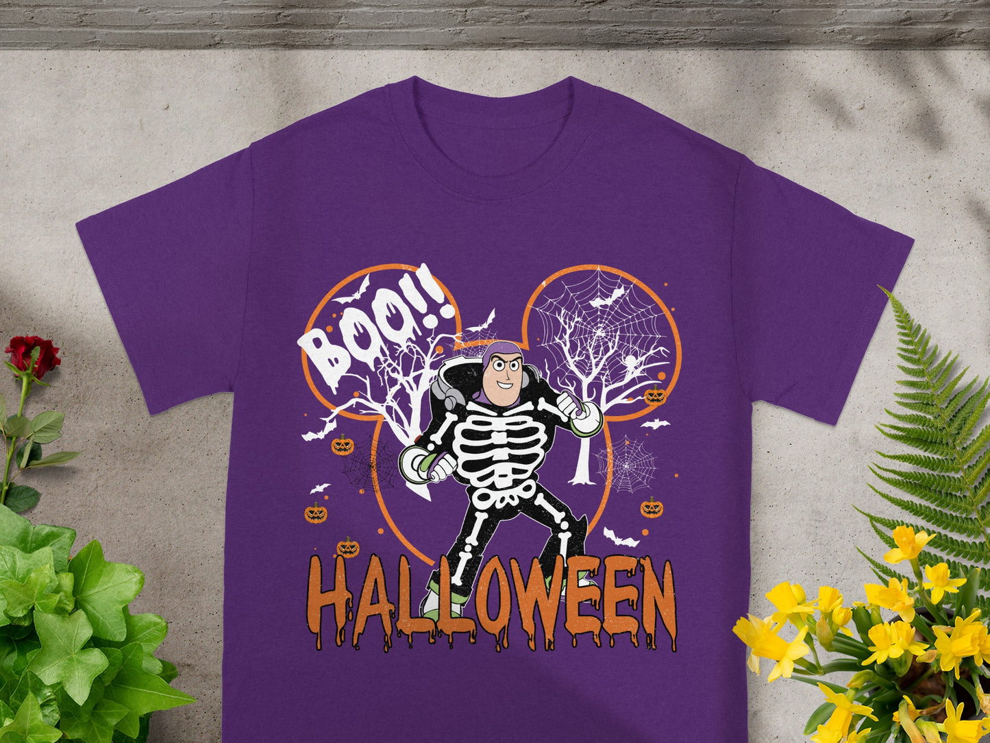 Purple t-shirt with Buzz Lightyear skeleton graphic and Halloween text.