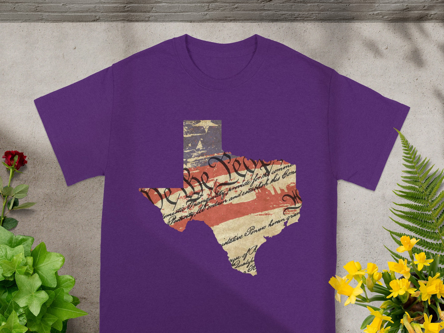 Purple t-shirt with the state of Texas outline featuring the Constitution and US flag.