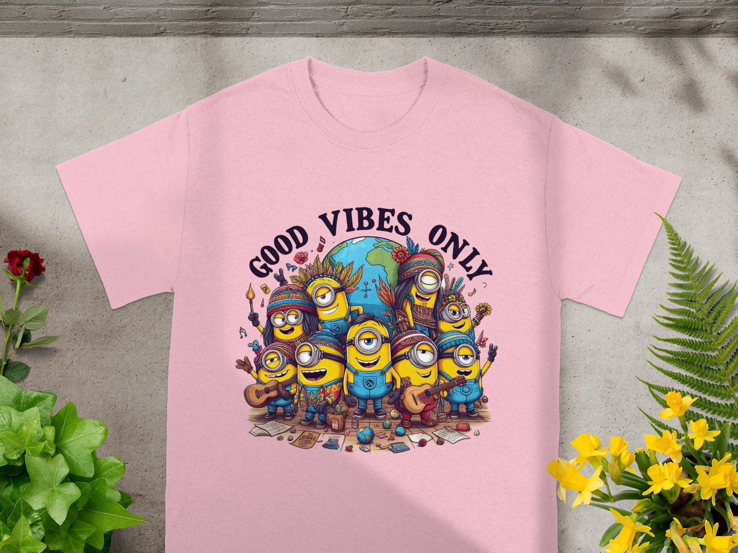 Pink t-shirt with "Good Vibes Only" text and a group of Minions around a globe.