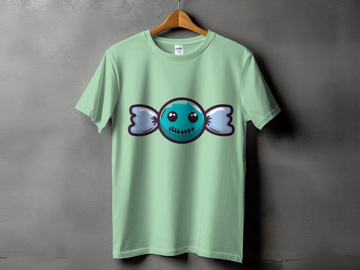 Mint green t-shirt featuring a cartoon blue candy with a stitched mouth.