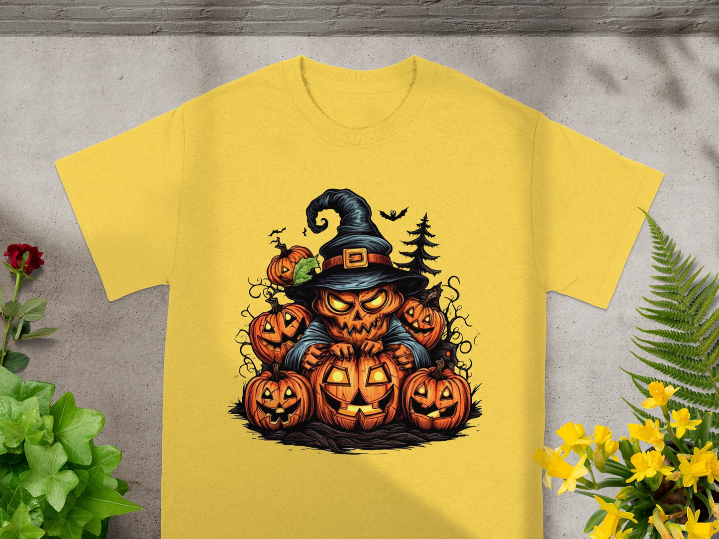 Yellow t-shirt featuring a jack-o'-lantern witch surrounded by pumpkins and spooky elements.