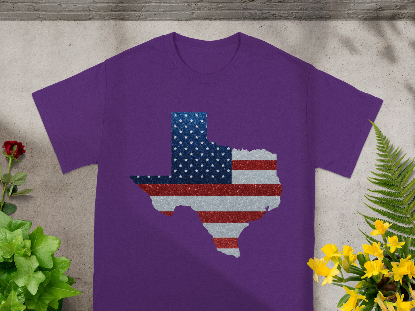 Purple t-shirt with a Texas outline filled with US flag stars and stripes pattern.