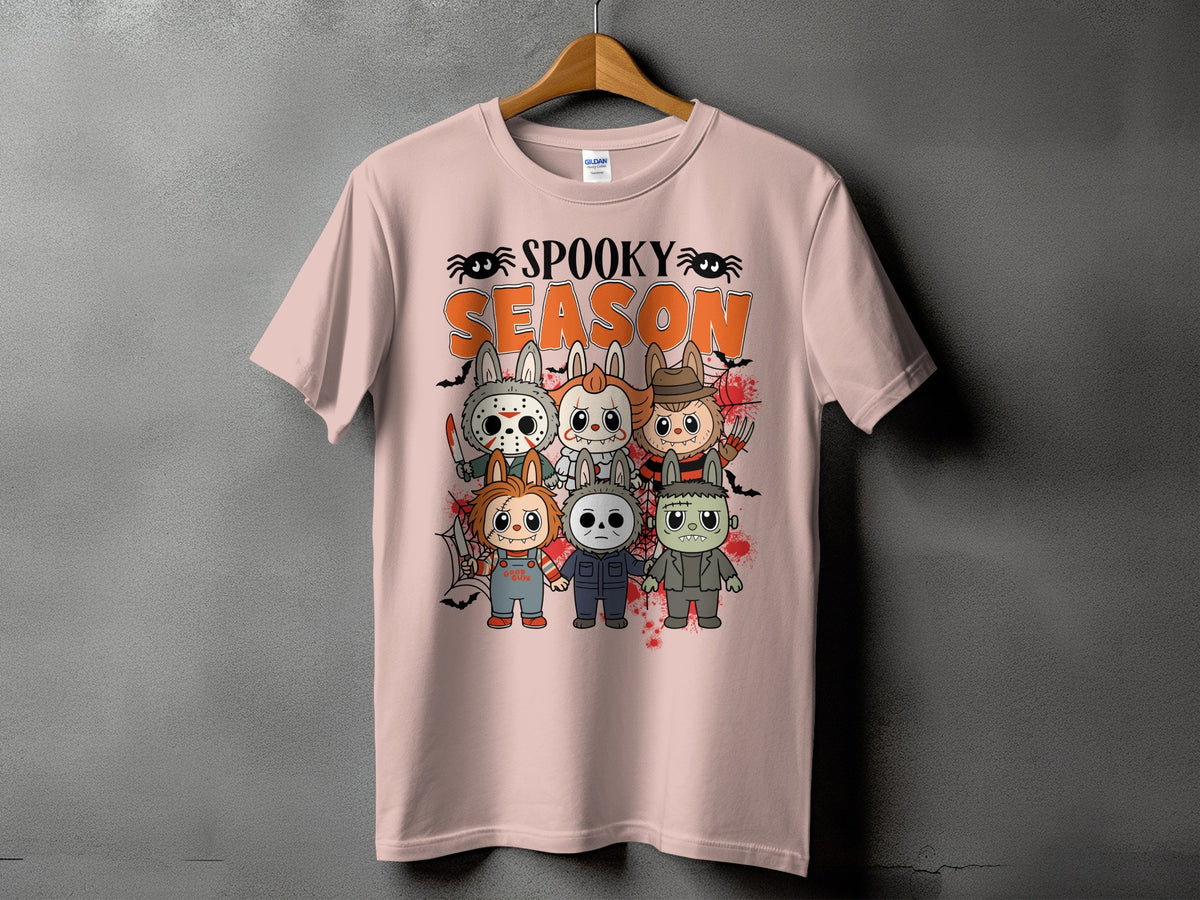Pink t-shirt with "Spooky Season" text and horror movie characters dressed as bunnies.