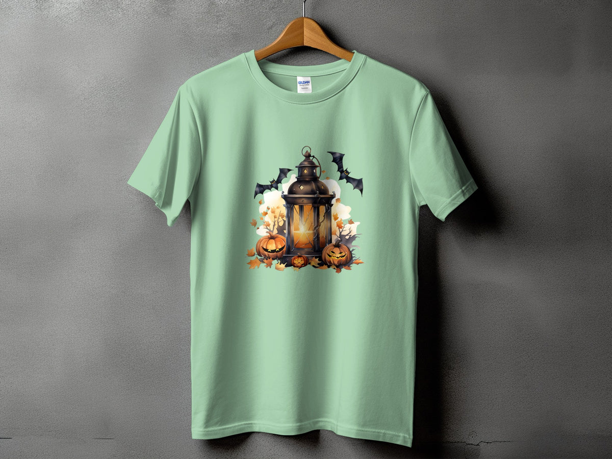 Light mint green t-shirt with a Halloween graphic of a lantern, pumpkins, and bats.