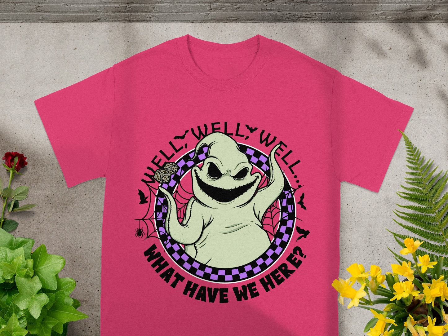 Pink t-shirt with Ooghe Booghe graphic saying "Well, Well, Well... What Have We Here?"