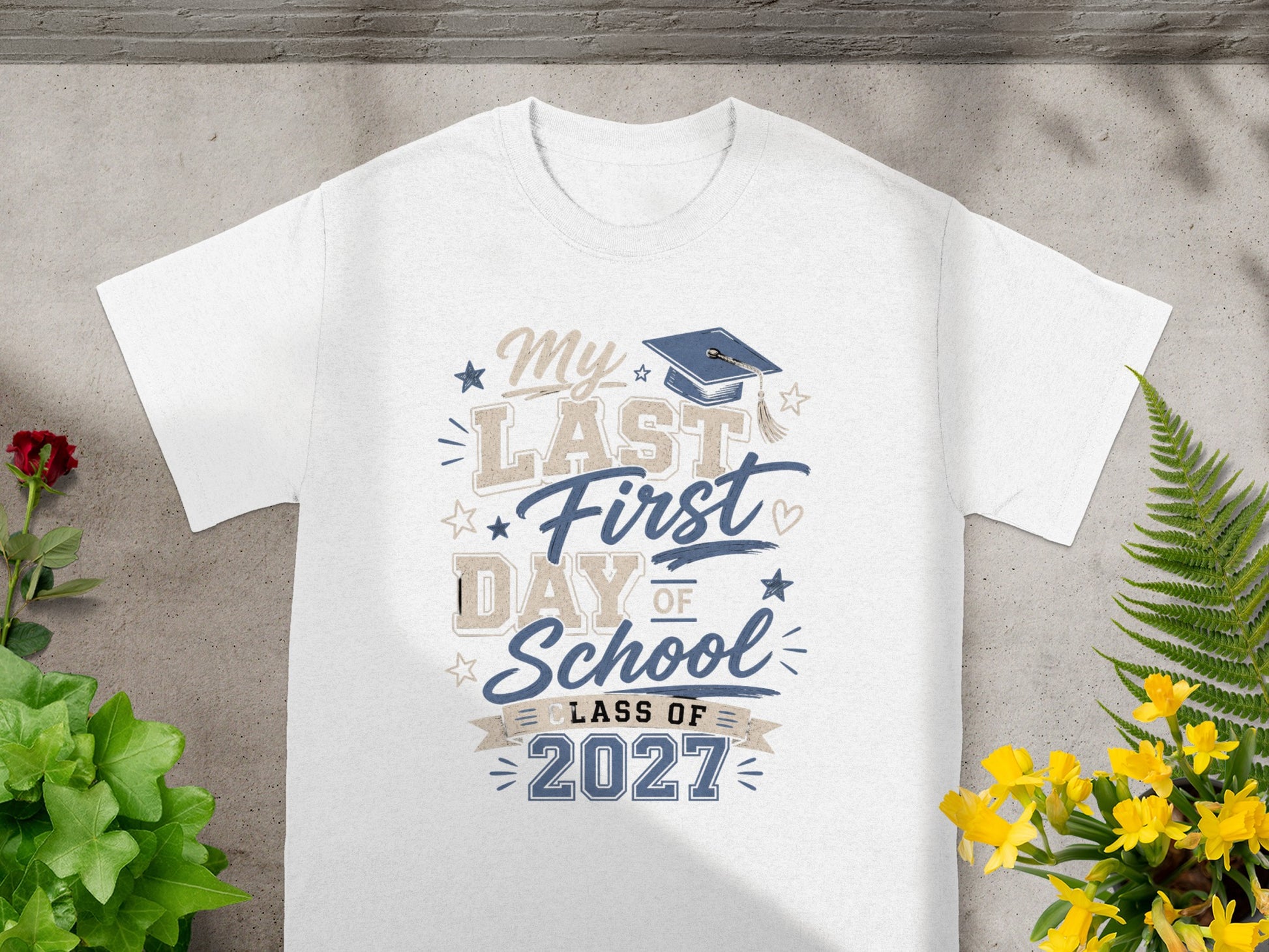 White t-shirt with "My Last First Day of School Class of 2027" text and graduation cap.