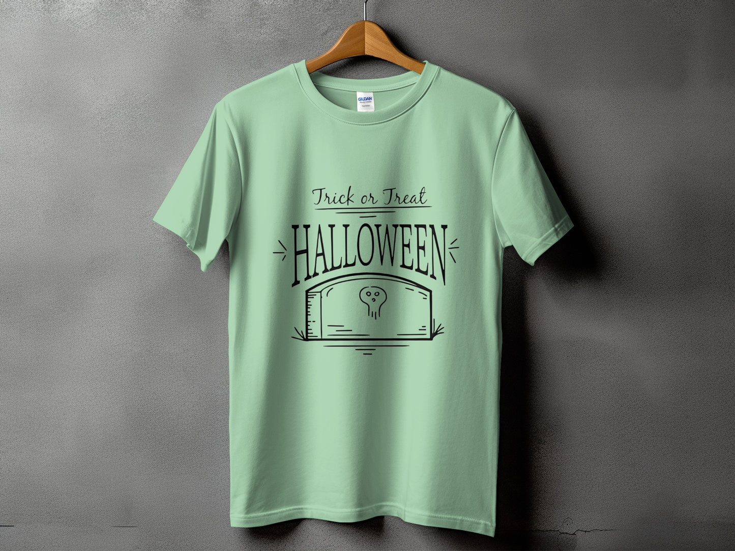 Mint green t-shirt with black "Trick or Treat Halloween" text and tombstone graphic.