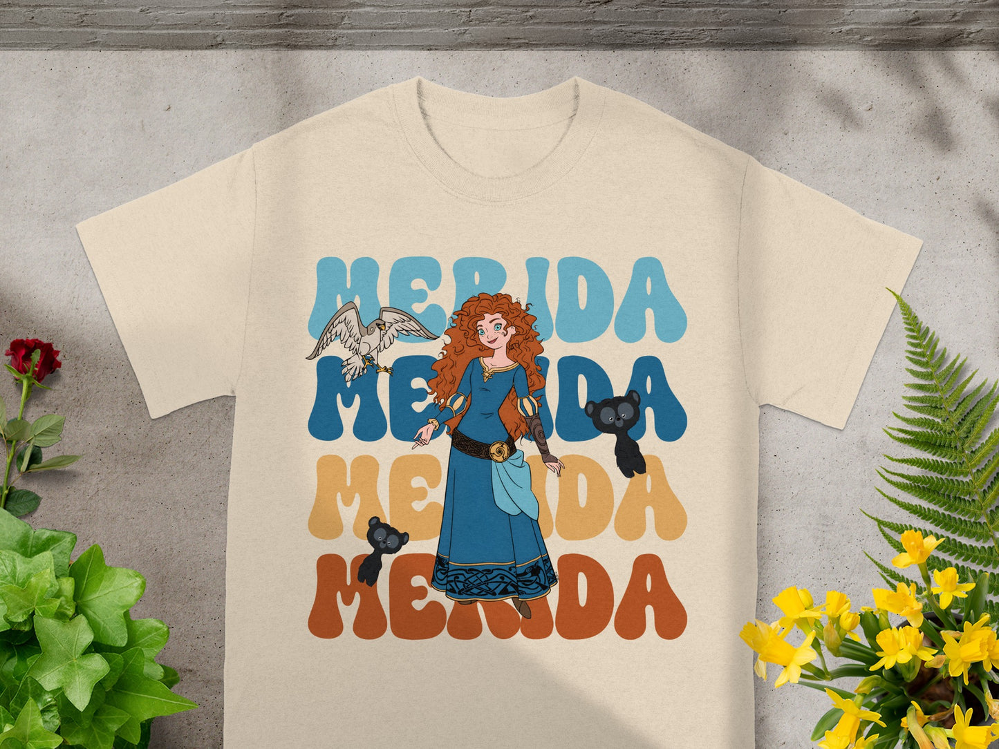 Merida illustration with bear and hawk, "Merida Merida" text.