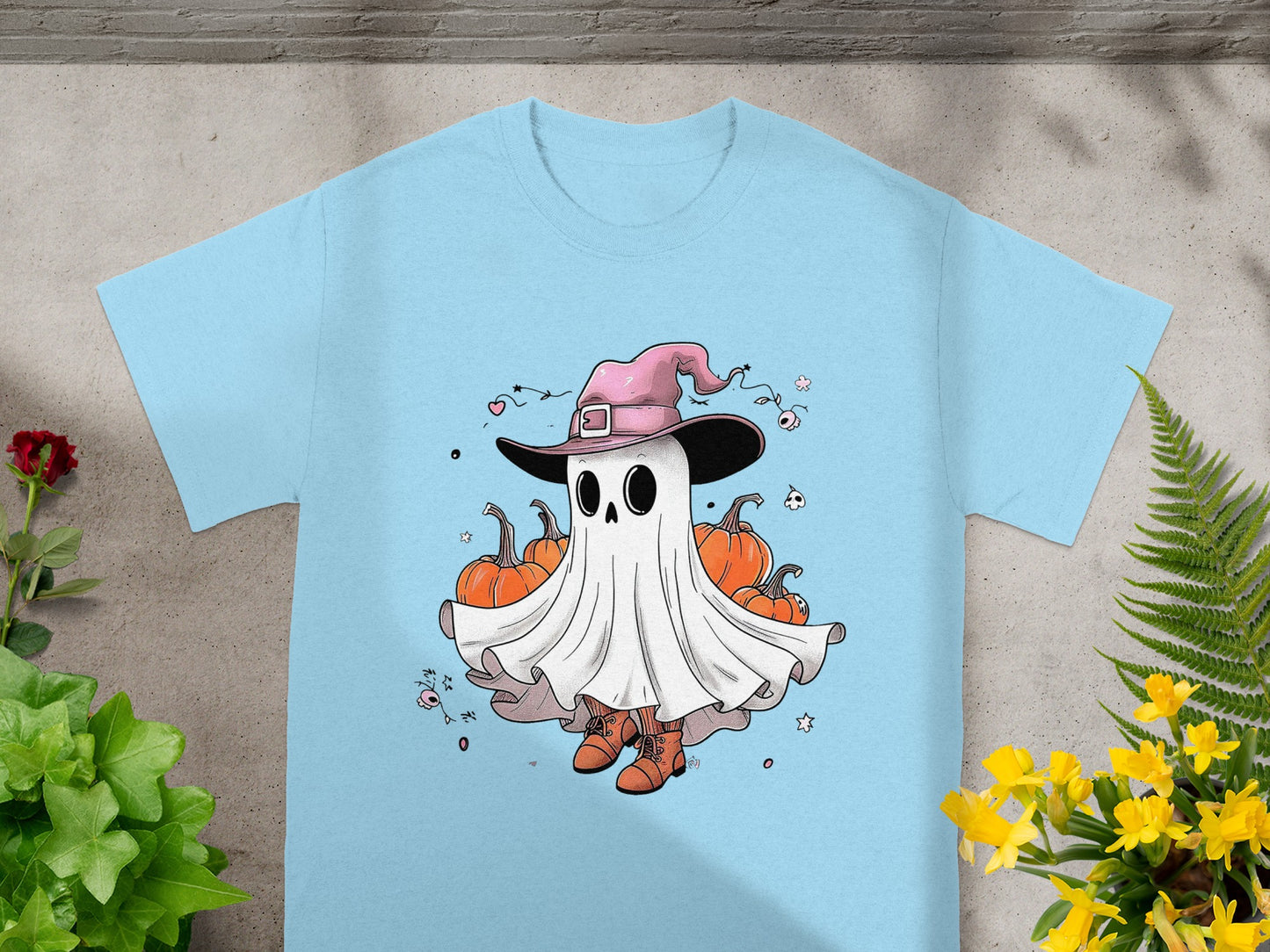 Cartoon ghost wearing a witch hat and boots, surrounded by pumpkins.
