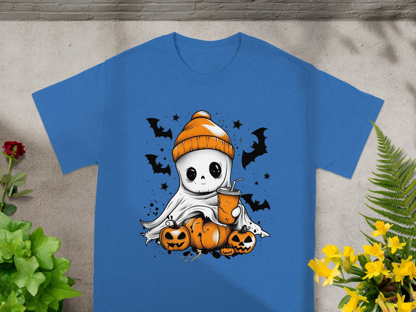 Ghost with orange beanie holding a drink, surrounded by pumpkins and bats.