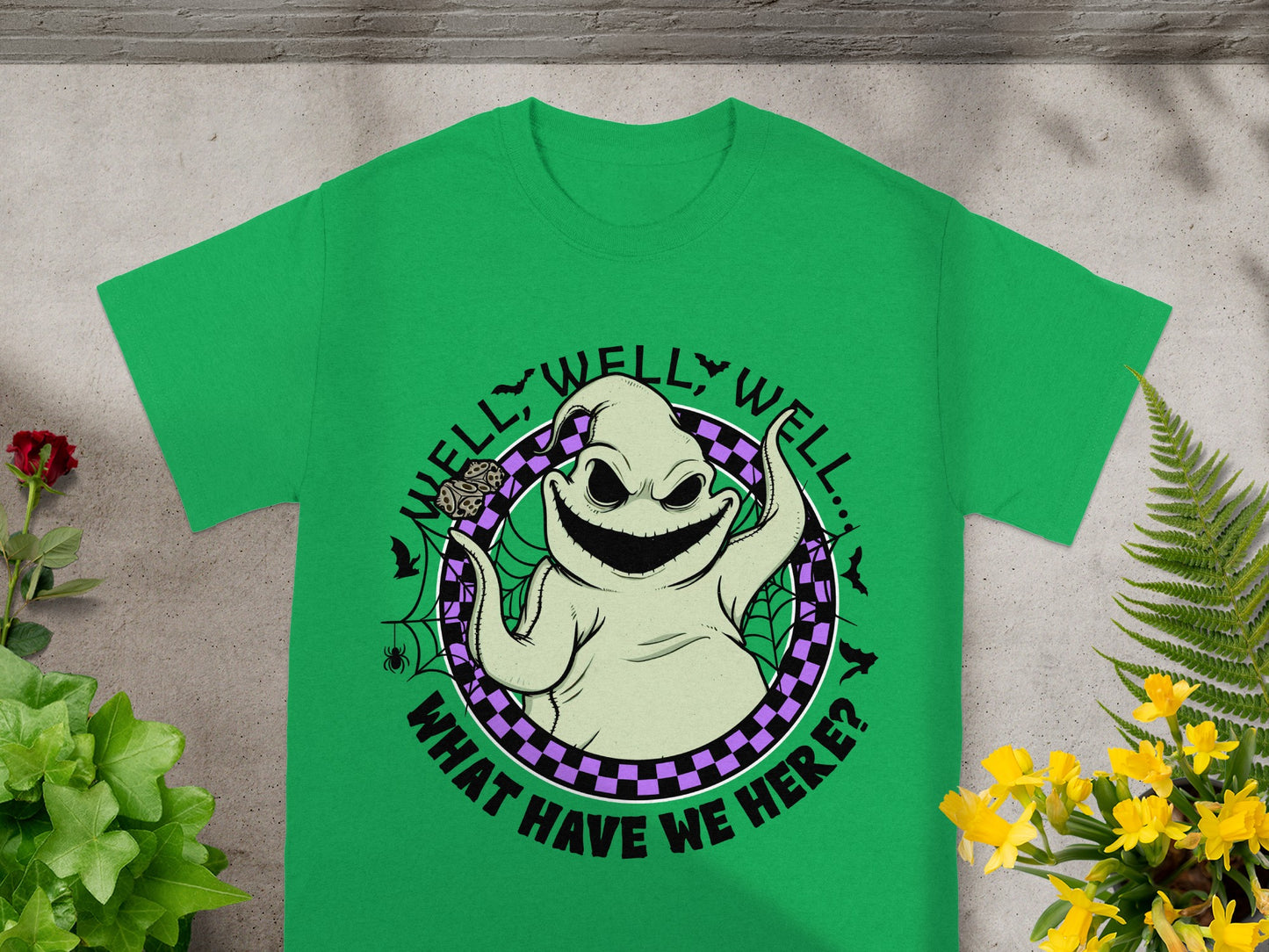 Oogie Boogie graphic on a green t-shirt with text "Well, well, well... What have we here?".