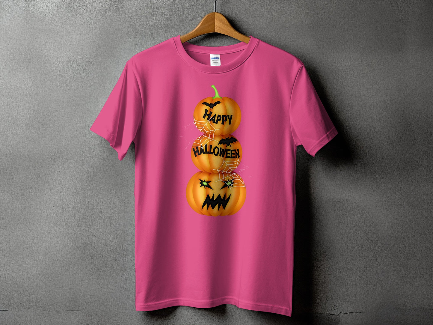 Pink t-shirt with stacked jack-o'-lanterns and "Happy Halloween" text.
