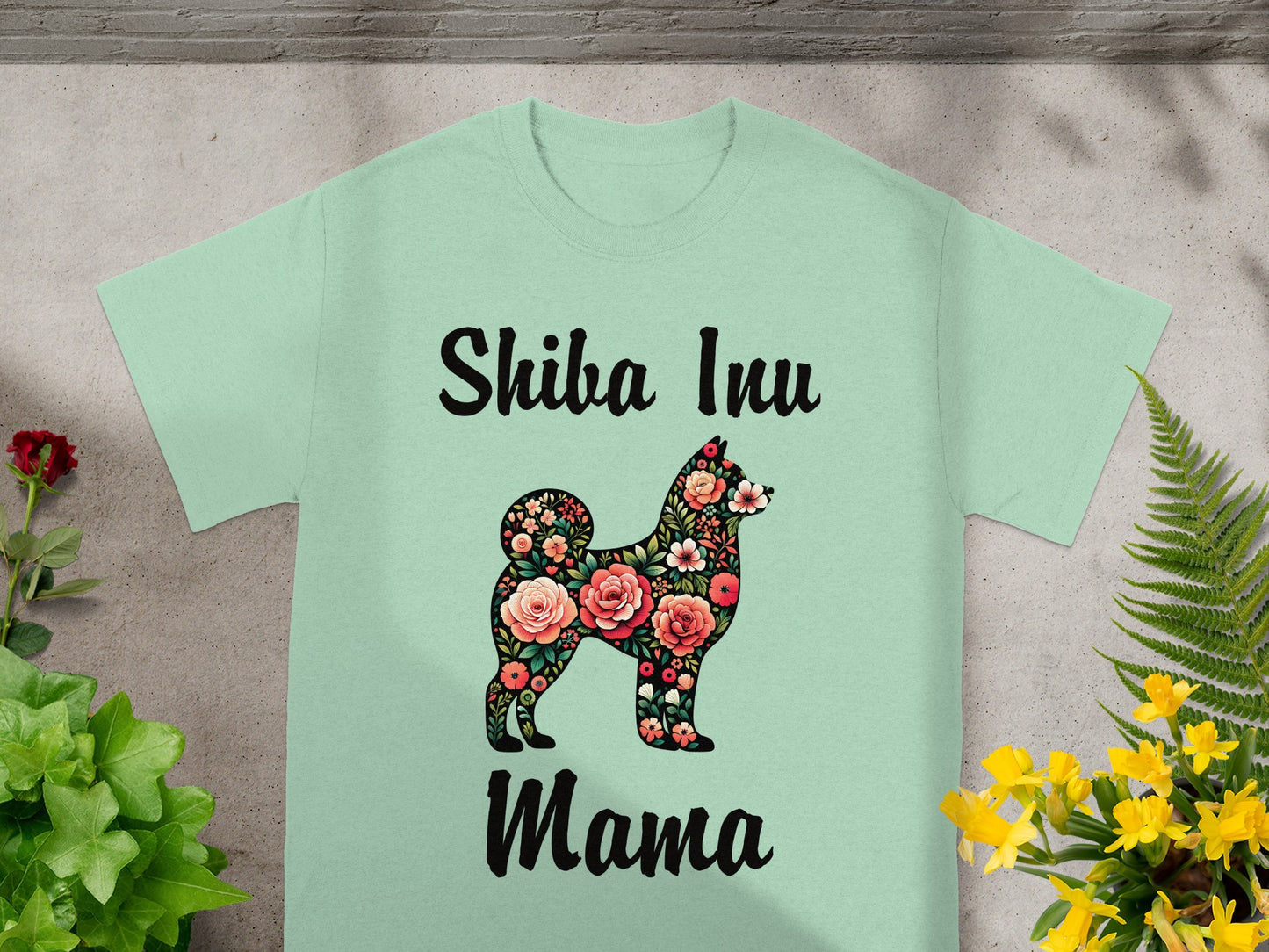 "Shiba Inu Mama" text with a floral Shiba Inu silhouette on a light green shirt.