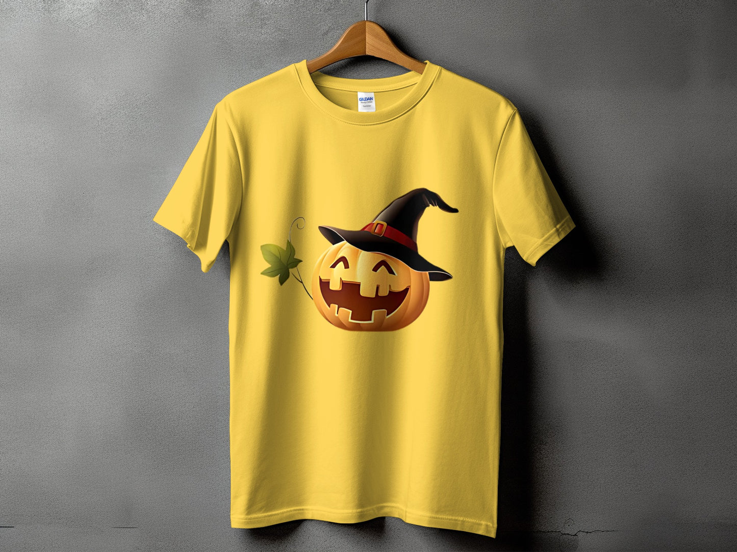 Yellow t-shirt with a smiling jack-o-lantern wearing a witch hat.
