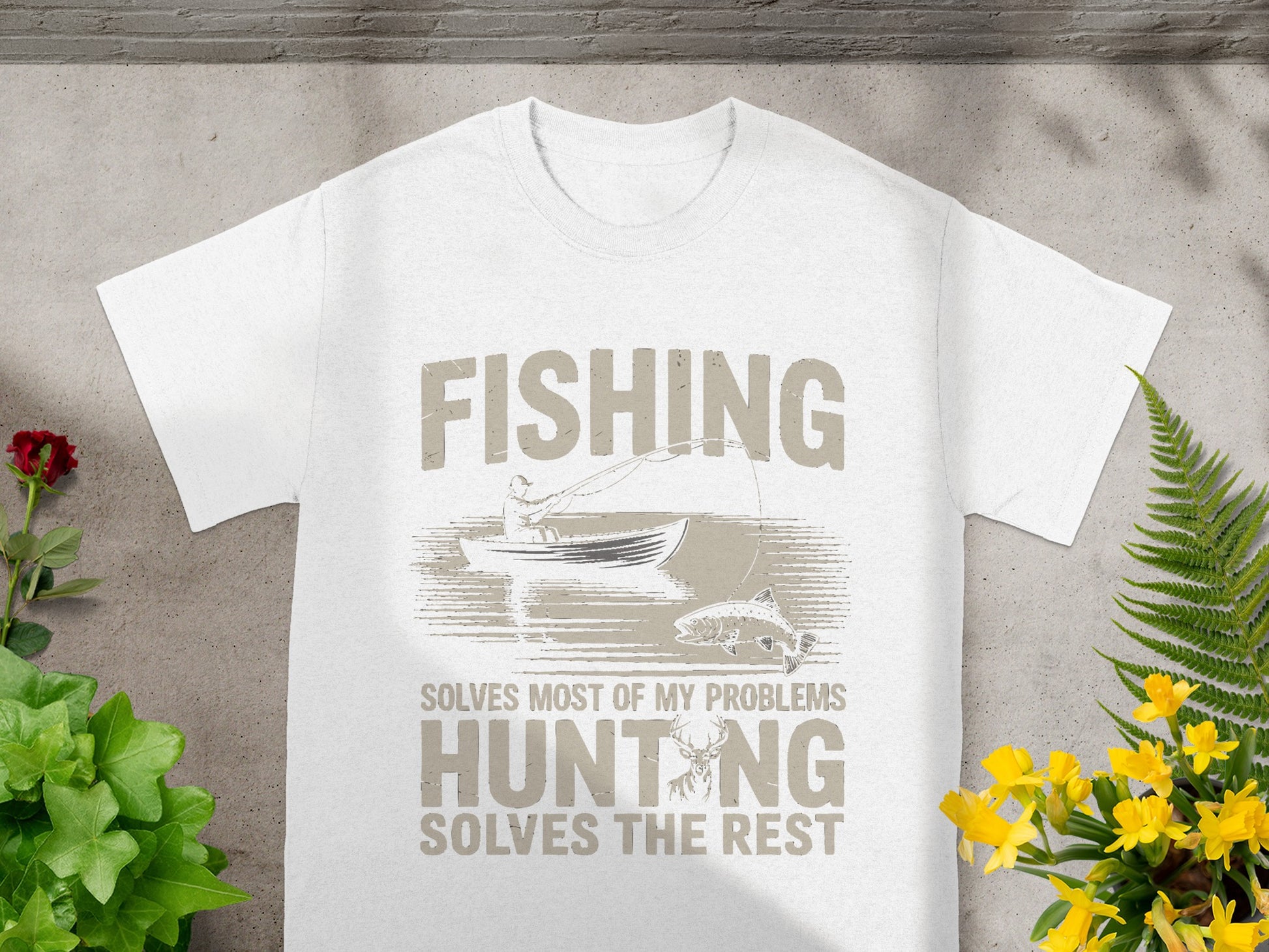 White t-shirt with "FISHING SOLVES MOST OF MY PROBLEMS HUNTING SOLVES THE REST" graphic.