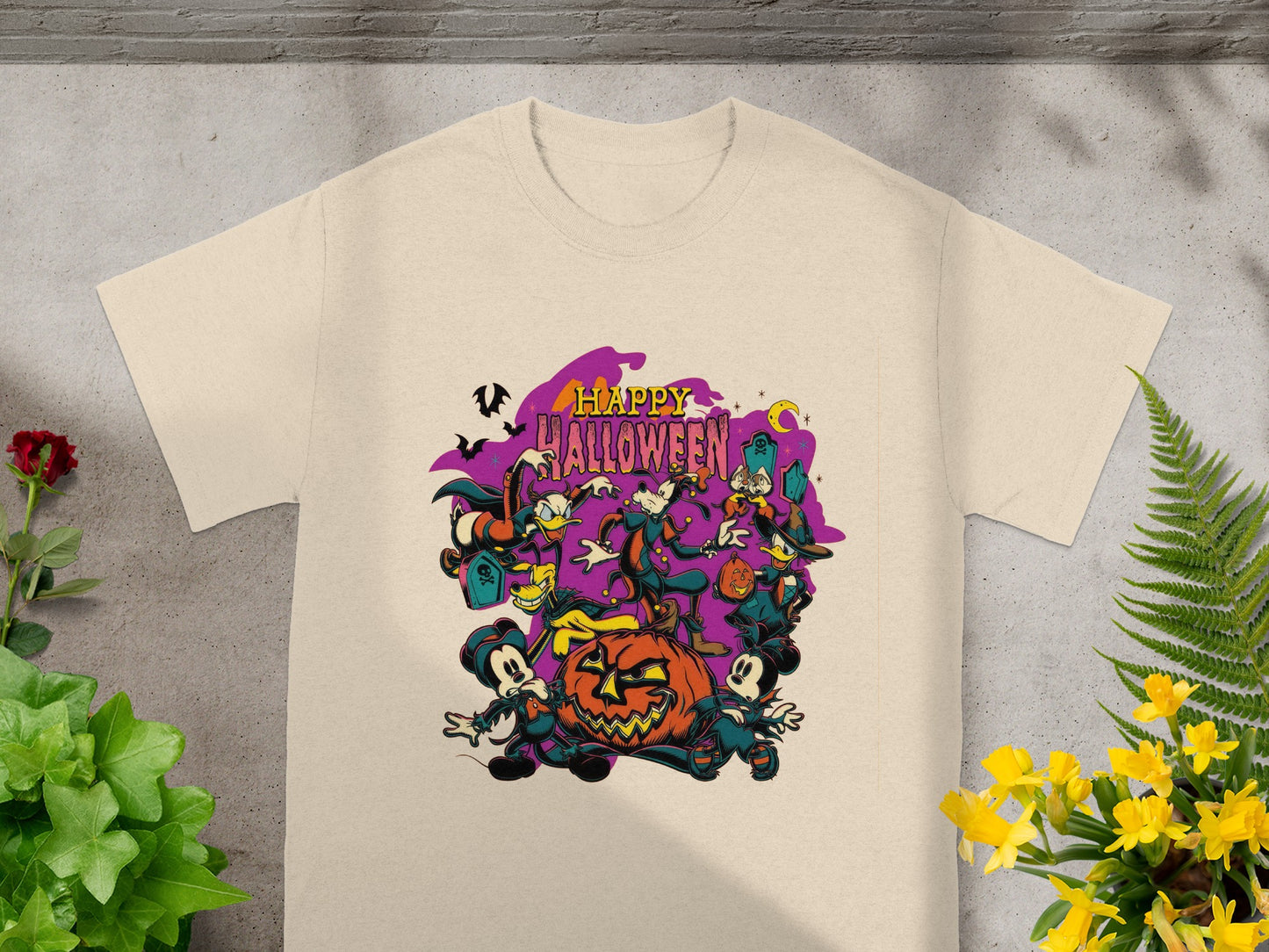 T-shirt with "Happy Halloween" text and cartoon characters around a jack-o'-lantern.