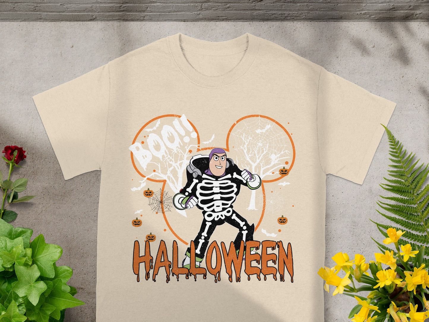Buzz Lightyear skeleton costume on a t-shirt with "Boo!!" and "Halloween" text.