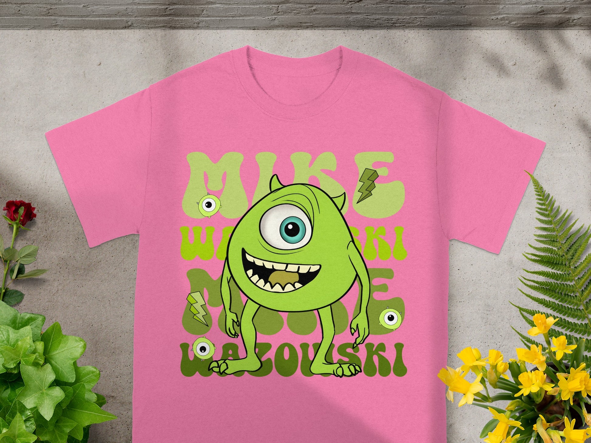 Pink t-shirt with cartoon Mike Wazowski from Monsters Inc.