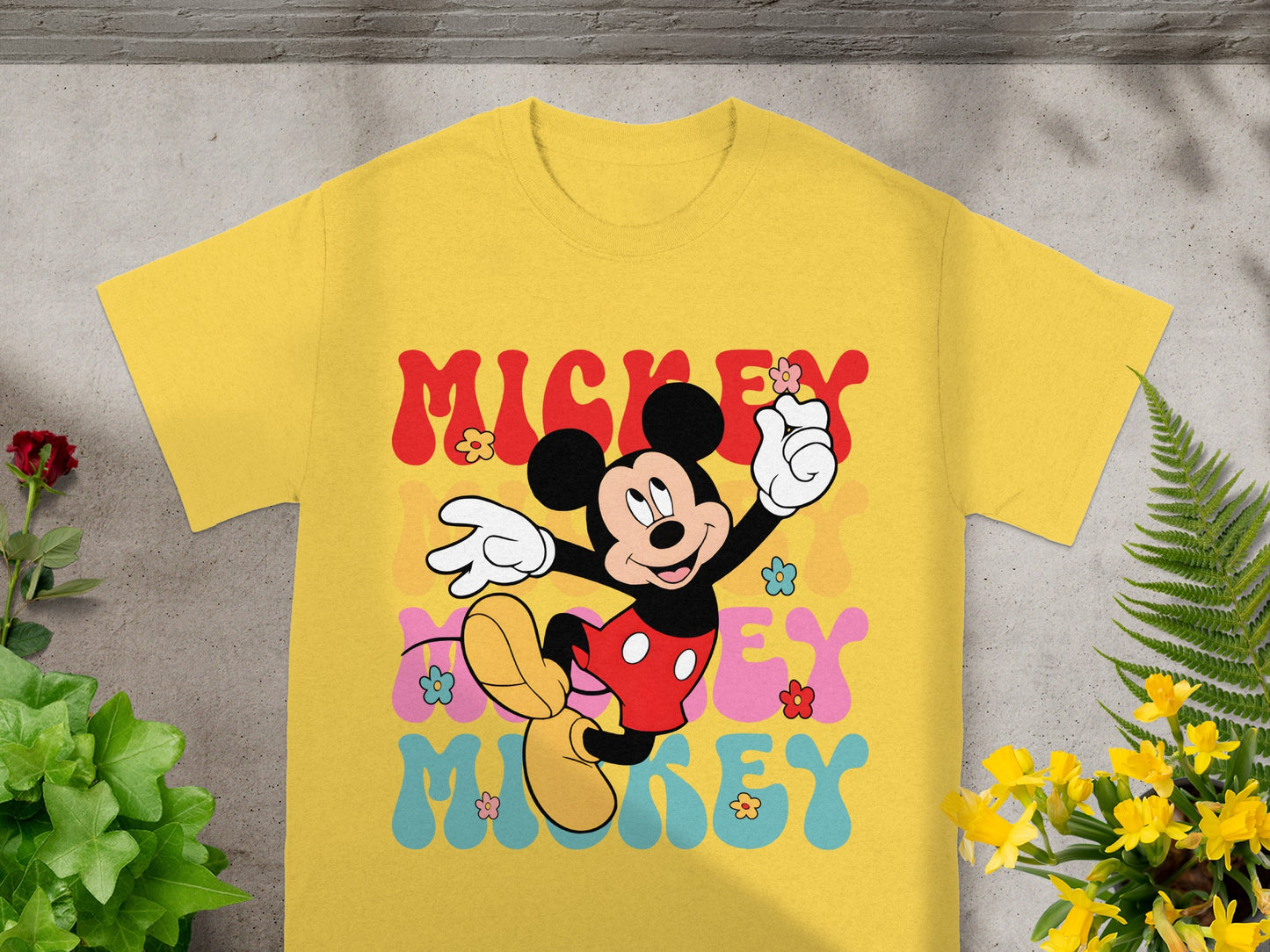 Yellow t-shirt with retro Mickey Mouse graphic and colorful "Mickey" text.
