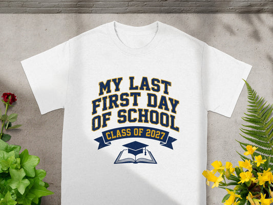 White t-shirt with "My Last First Day of School Class of 2027" text and graduation graphic.