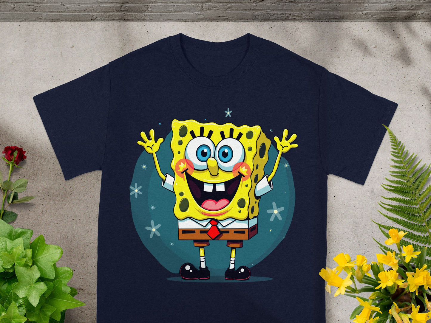 SpongeBob SquarePants character smiling with arms raised on a navy t-shirt.