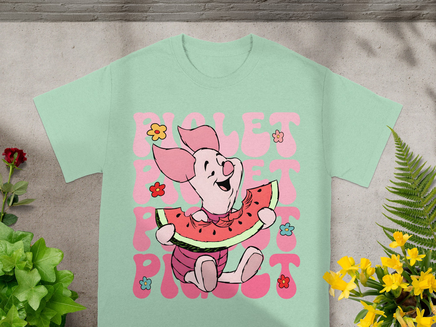 Piglet eating watermelon with "Piglet" text in a retro font.