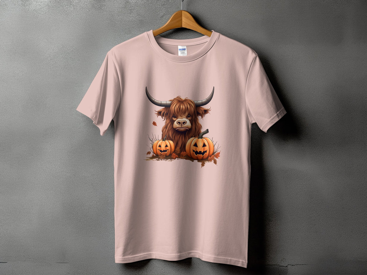 Pink t-shirt with a Highland cow and two jack-o'-lanterns design.
