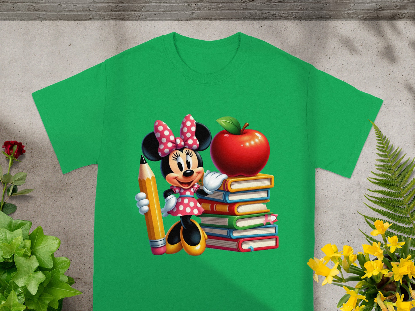 Minnie Mouse holding a pencil next to a stack of books with an apple on top.