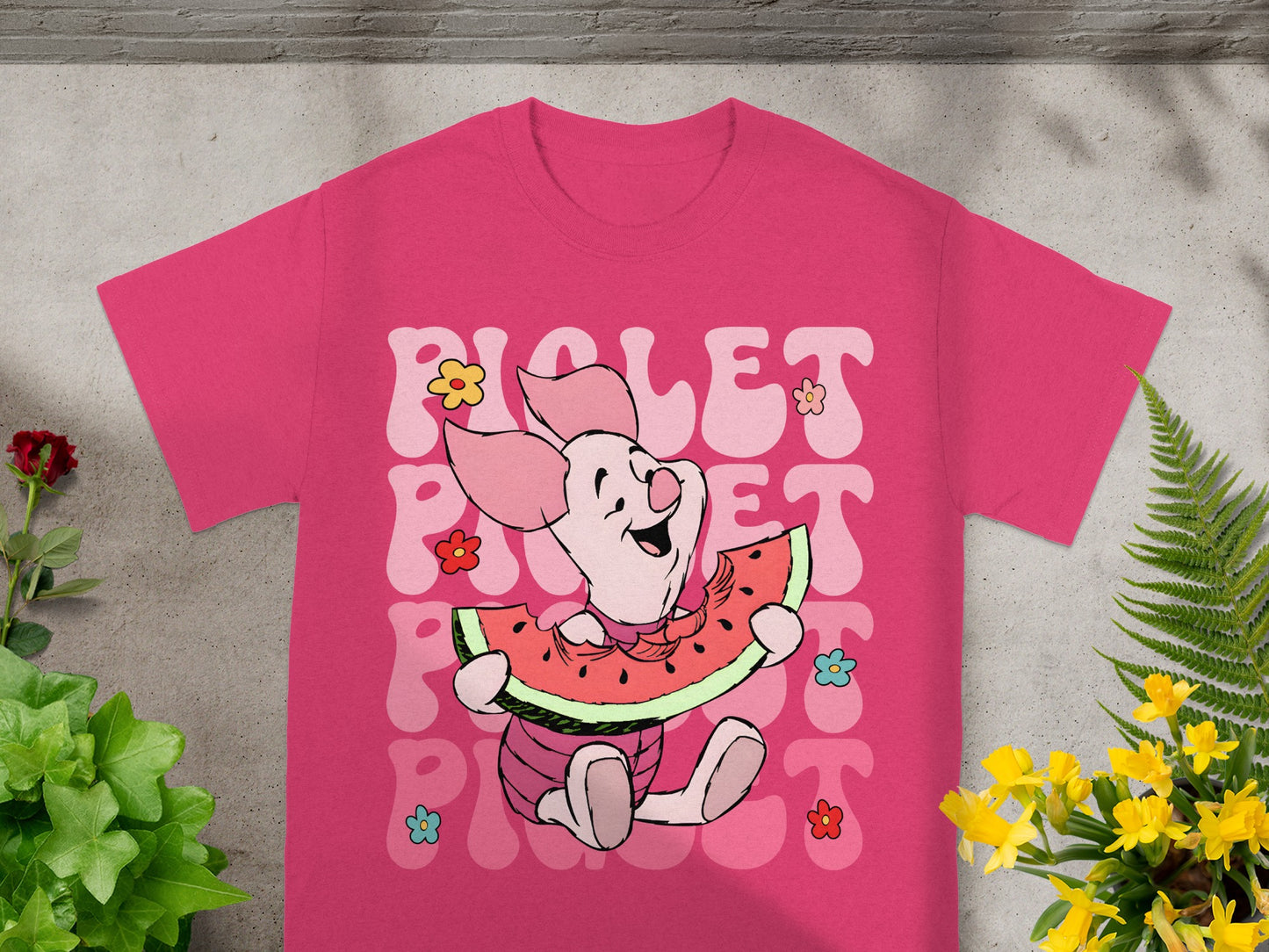 Pink t-shirt with Winnie the Pooh's Piglet eating watermelon.