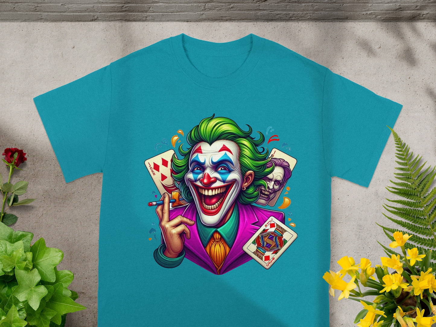 Green-haired Joker with cards and playing cards on teal t-shirt.
