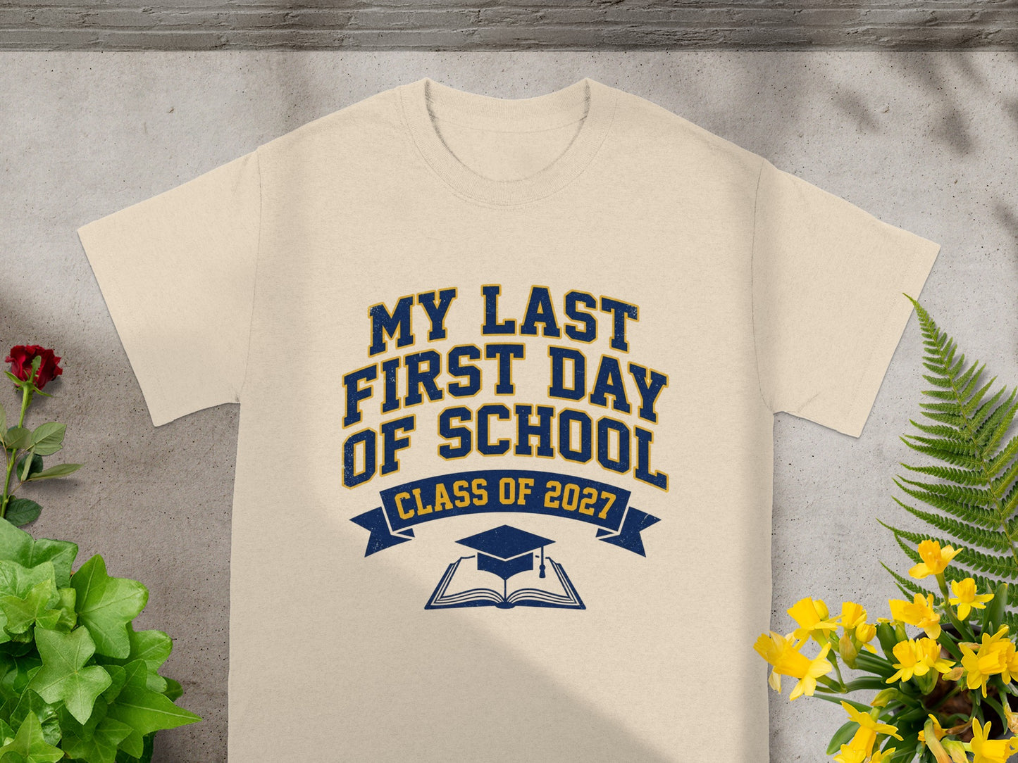 Cream t-shirt with "MY LAST FIRST DAY OF SCHOOL CLASS OF 2027" text.