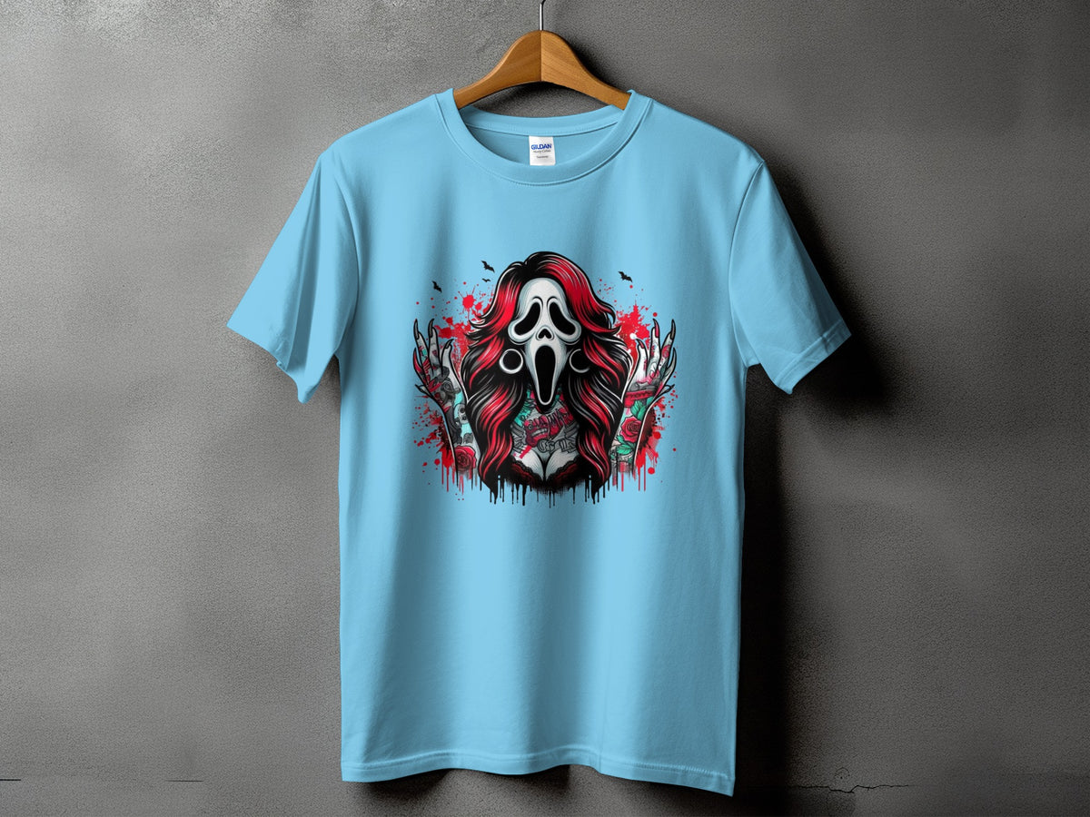 Light blue t-shirt with graphic of screaming ghost mask, roses, and tattoos.